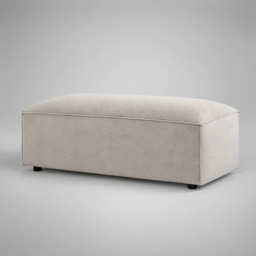 Prostokątny podnóżek tapicerowany bouclé jasnobeżowy z czarnymi nóżkami 100 x 60 x 42 cm
